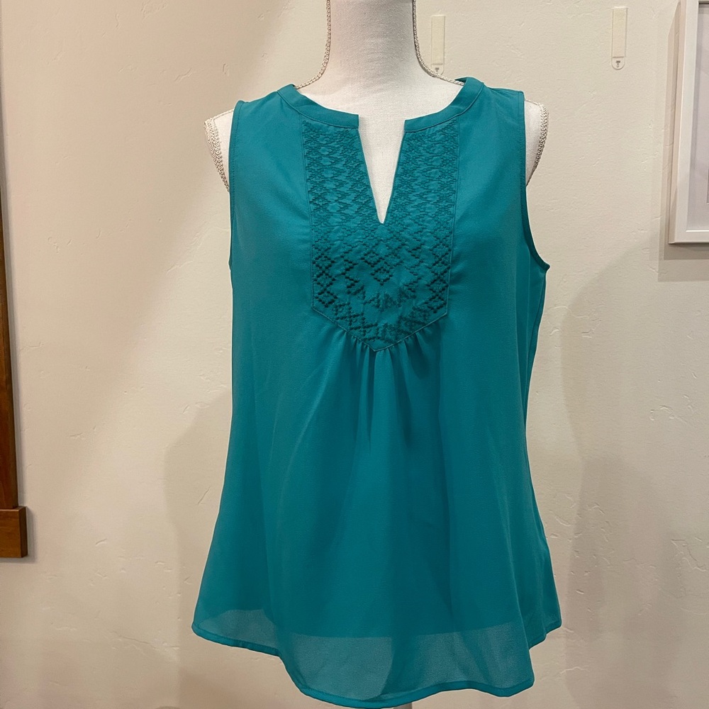 Market and spruce turquoise tank